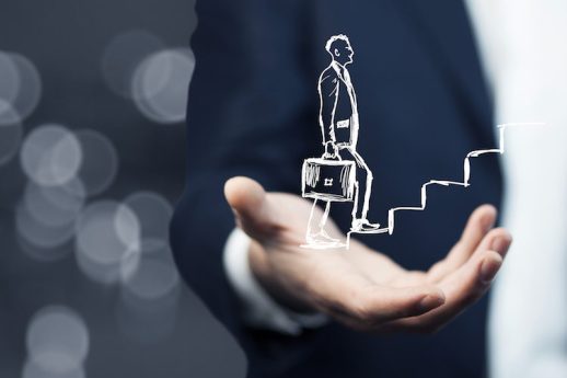 human hand drawing career ladder with chalk